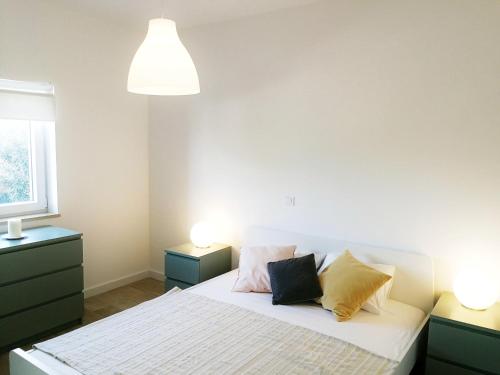 Ένα ή περισσότερα κρεβάτια σε δωμάτιο στο Apartmani Marijana