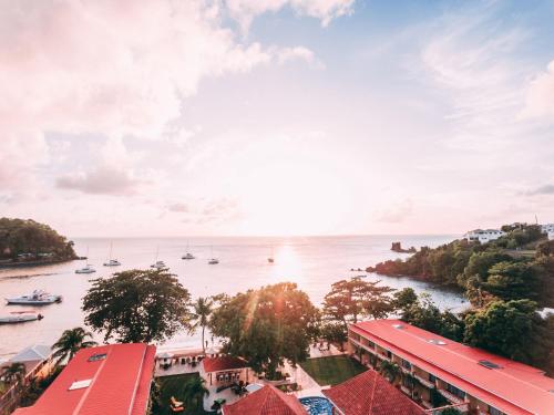 a view of a river with boats in the water at Sunset Shores Beach Hotel in Kingstown