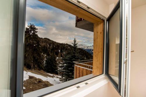 a room with a window with a view at Chalet la cordée in Bettmeralp