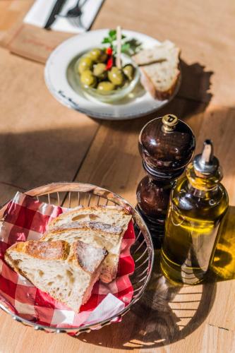 a table with a plate of bread and a plate of food at Tenuta San Felice in Giano dellʼUmbria