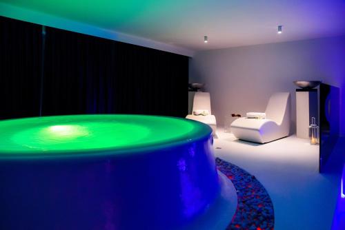 Postel nebo postele na pokoji v ubytování Le Camp Suite & Spa