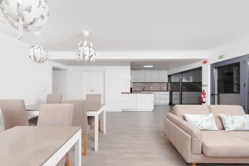 a living room with a couch and a table at Pico Dreams in São Roque do Pico