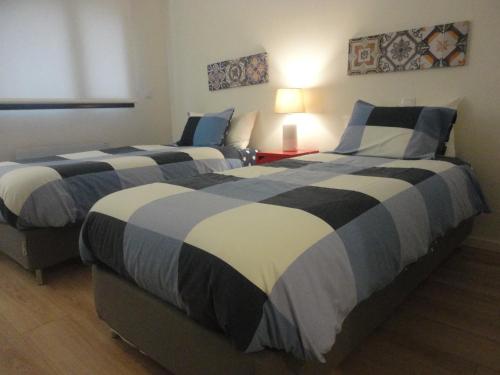 Katil atau katil-katil dalam bilik di Oporto Like Home II