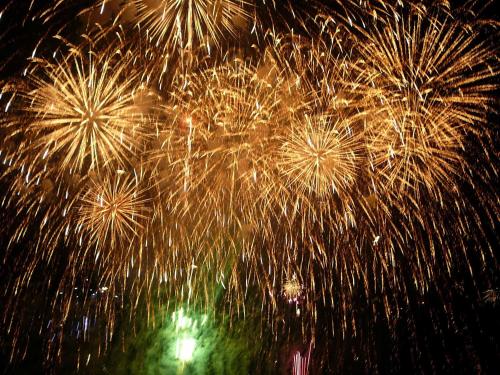 a bunch of fireworks exploding in the night sky at Canadian Loghouse Inn AzuminoYujin in Azumino