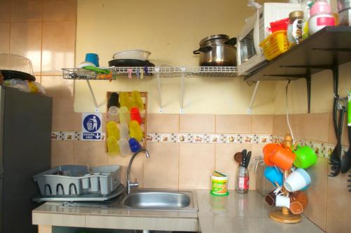 a kitchen with a sink and a counter top at Passion Hostel - Barranco in Lima