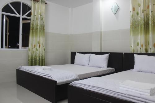 Postel nebo postele na pokoji v ubytování HaiVan HosTel