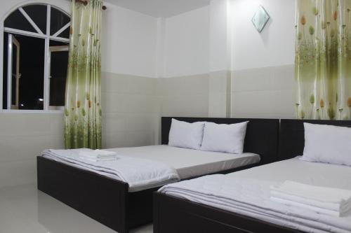 Giường trong phòng chung tại HaiVan HosTel