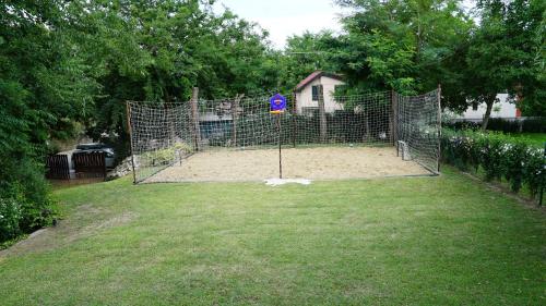 a cage with a dog in it in a yard at TOBO house along the river Danube in Radvaň nad Dunajom
