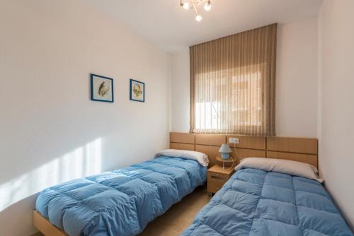 Postel nebo postele na pokoji v ubytování Apartamentos Jardines del Mar II
