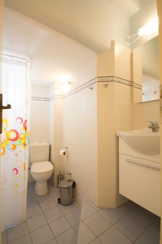 a bathroom with a toilet and a sink at Paros Parikia house in Parikia