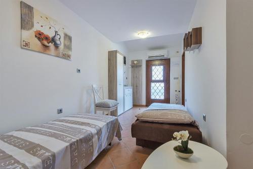Postel nebo postele na pokoji v ubytování Apartments Monte Grande