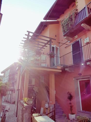 a building with stairs and balconies on it at Ca' Irri Apartment in Baveno