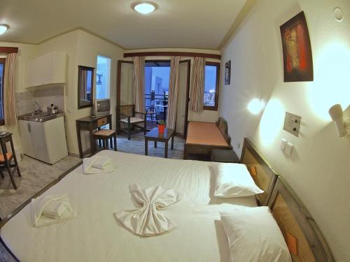 Ένα ή περισσότερα κρεβάτια σε δωμάτιο στο Alexandros M