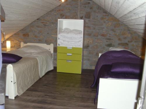 En eller flere senge i et værelse på Les Chanterelles