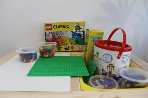 a toy table with a box of legos and a box of cereal at Afiniti Residensi Legoland Medini in Nusajaya