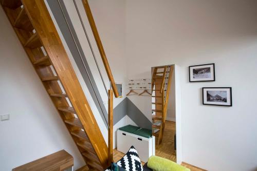 a room with stairs and shelves in a room at Krona Apartments in Bovec