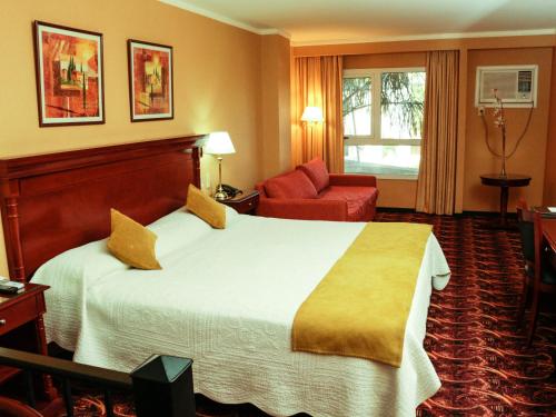 Säng eller sängar i ett rum på Condado Hotel Casino Santo Tome