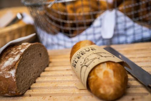 a loaf of bread and a knife on a table at ibis München City Süd in Munich
