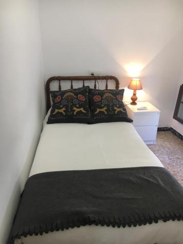 Postel nebo postele na pokoji v ubytování La casita de la ciudad