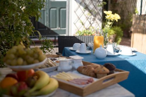 a blue table with a tray of food on it at Palazzo Bernardini Suites in Lecce