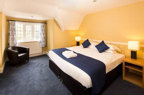 A bed or beds in a room at The Inn at Woodhall Spa