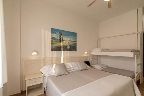 Postel nebo postele na pokoji v ubytování Trevi Family Resort