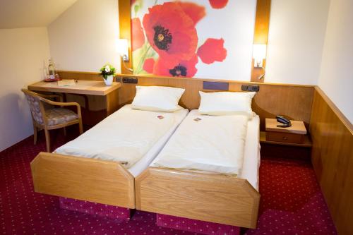 Ένα ή περισσότερα κρεβάτια σε δωμάτιο στο Gasthof-Hotel Harth