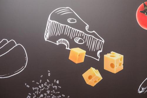 a chalk drawing of a piece of cheese at ibis München City Süd in Munich