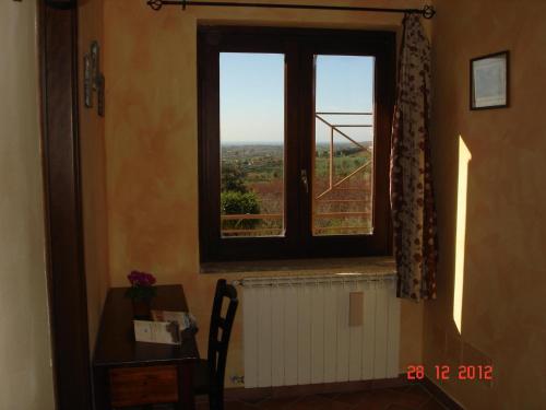 a window in a room with a view at Agriturismo Casale Di Gricciano in Cerveteri