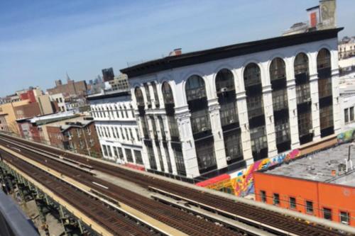 a view of a city with train tracks and buildings at Hotel 1080 in Brooklyn