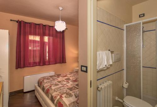 Llit o llits en una habitació de Hotel Il Giardino