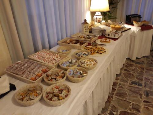a buffet table with many different types of food at Albergo Miramonti in Arta Terme