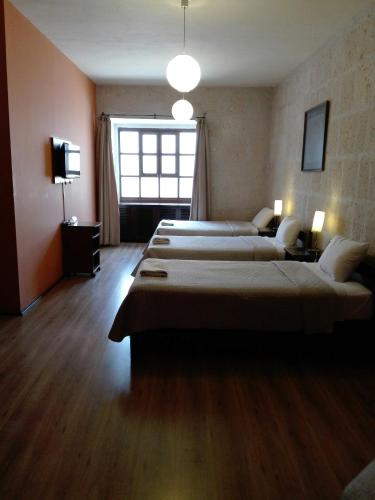 Cama o camas de una habitación en Casablanca Hostal