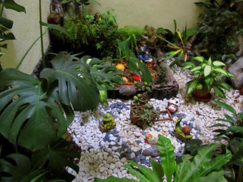 a small garden with plants and rocks in a room at Hostal Rural Elosta in Lekunberri