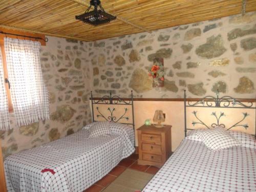 La Casa Del Llano tesisinde bir odada yatak veya yataklar