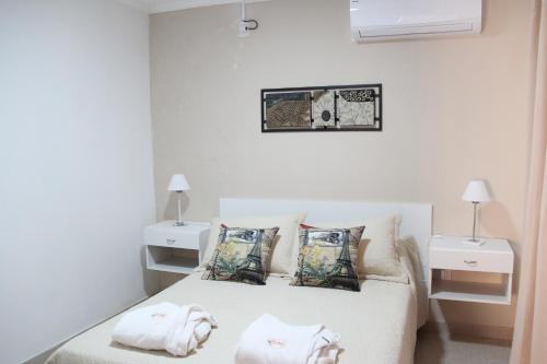 Una cama o camas en una habitación de Complejo Amarelo