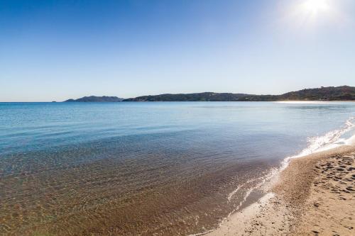 a view of a beach with the sand and water at Molarotto in Porto Taverna