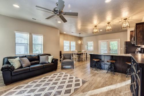 a living room with a couch and a bar at Watchman Villas in Springdale