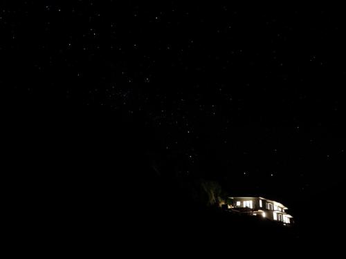 a house at night with its lights on at Big Sky Nelson Luxury Eco B&B in Nelson
