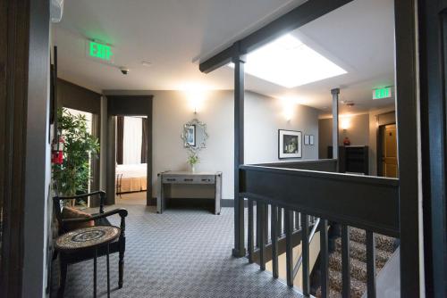 a hallway with a stairway with a room at Camas Boutique Hotel in Camas