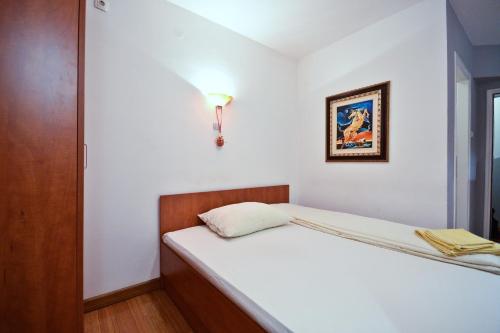 Ein Bett oder Betten in einem Zimmer der Unterkunft Apartments Imper - IMD