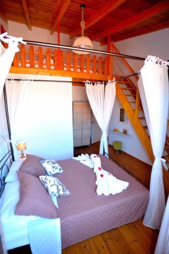 a bedroom with a large bed in a room at Pithari Villa in Agios Dimitrios