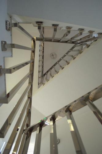 a clock on the wall of a room with a ceiling at Garden Spa Boutique Hotel in Skopje