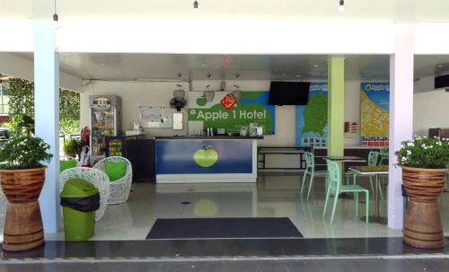 a store front with tables and chairs in a store at Apple 1 Hotel Gurney in George Town