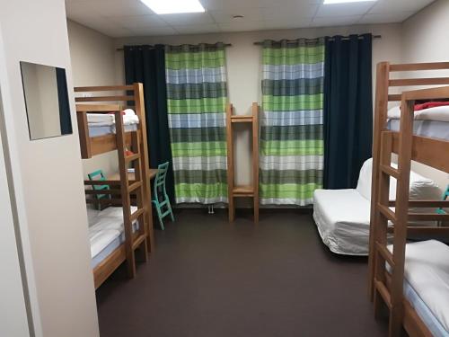 a room with several bunk beds in a dorm at Everest Kivioli Hostel in Kiviõli