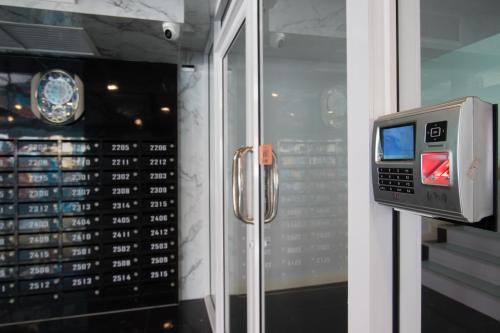 a watch display in a store window with a clock at B-your home Hotel Don Mueang Airport Bangkok 如你家酒店 in Bangkok