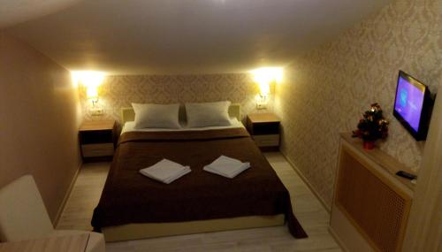 Кровать или кровати в номере Отель Юсупов