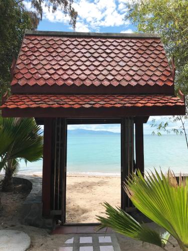 a building with a view of the beach at Sunshine Residence in Baan Tai