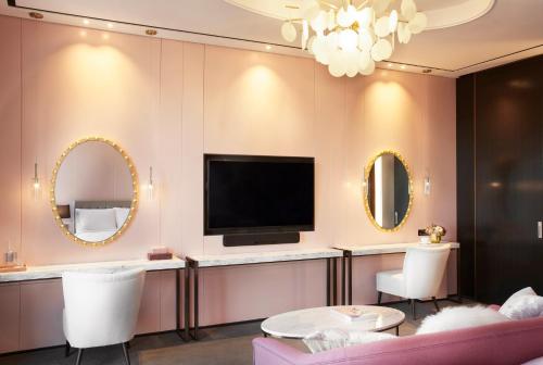 
a bathroom with a large mirror and a television at L7 Gangnam by LOTTE in Seoul
