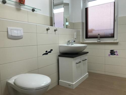 Ванная комната в Ferienwohnungen am Hafen